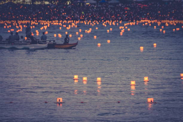 Lanterns begin to be floated in the annual Memorial Day Lantern Floating Festival held at Ala Moana Beach Honolulu, Hawaii stock photo