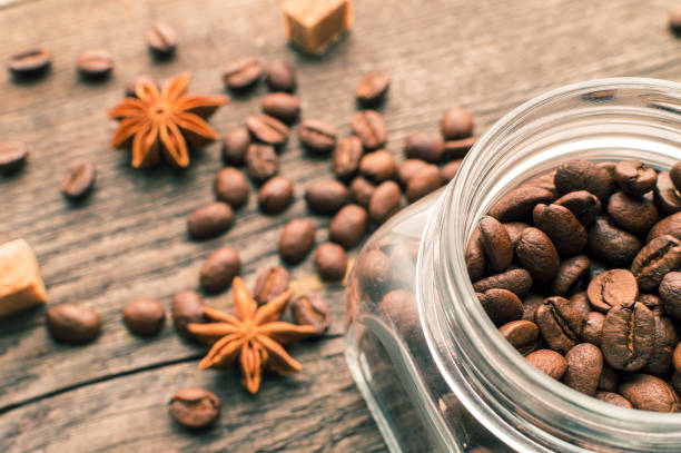 istock Coffee beans into glass jar table with sugar and anise 683443676