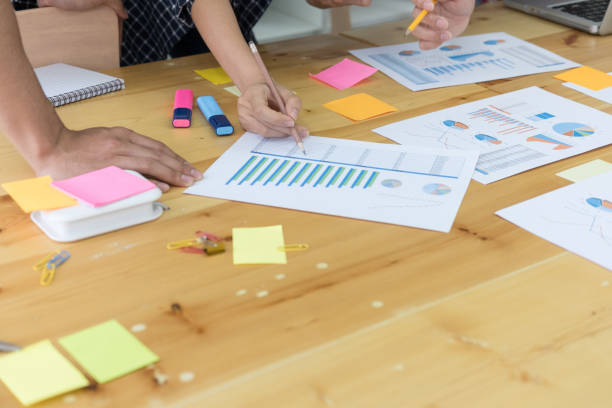istock startup young successful team on meeting in modern office interior brainstorming, make a business plan, working on financial and marketing graph and chart 683444680