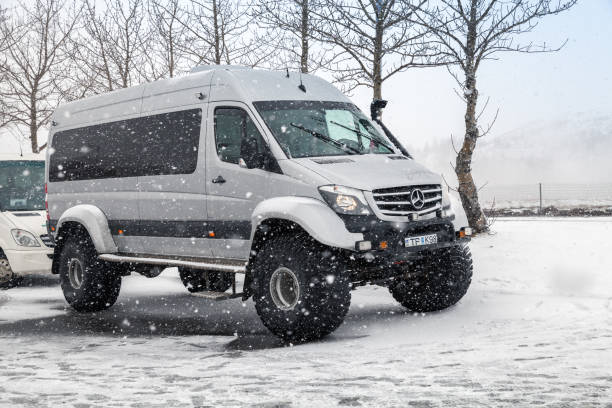 Reykjavik, Iceland - April 5, 2017: Mercedes-Benz Sprinter off-road Icelandic edition stands on snowy road. Originally it is a vehicle built by Daimler AG of Stuttgart