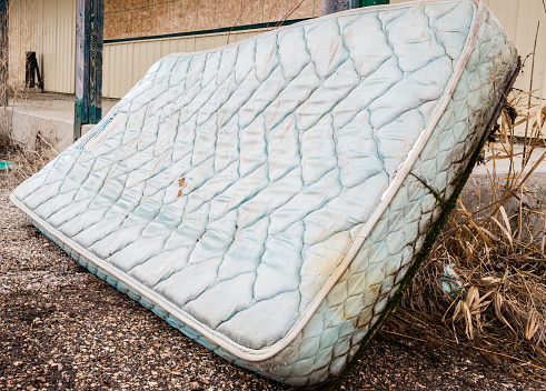 old water logged ruined bed mattress.