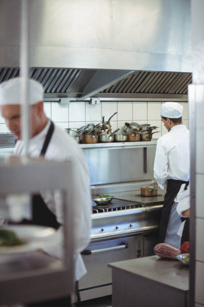 istock Chefs preparing food in the commercial kitchen 683455500