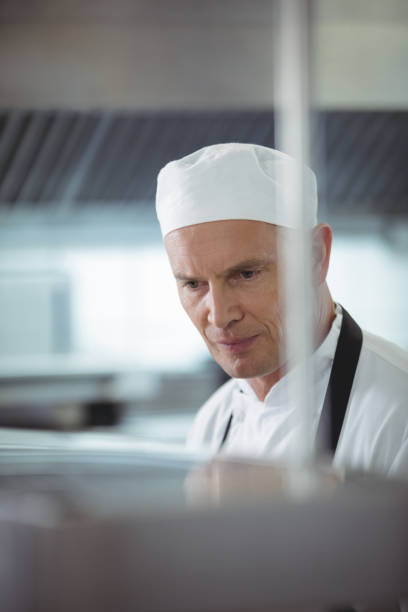 istock Chef preparing food in the commercial kitchen 683455524