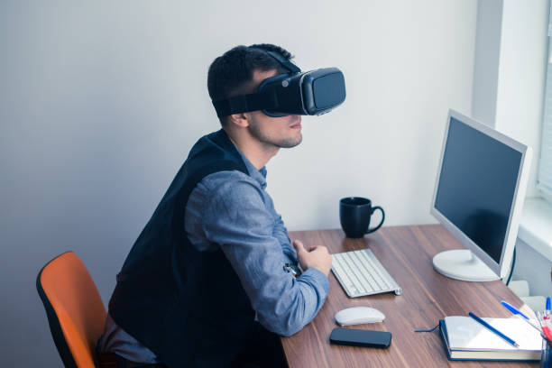 istock Young businessman in vr glasses looking forward 683461626