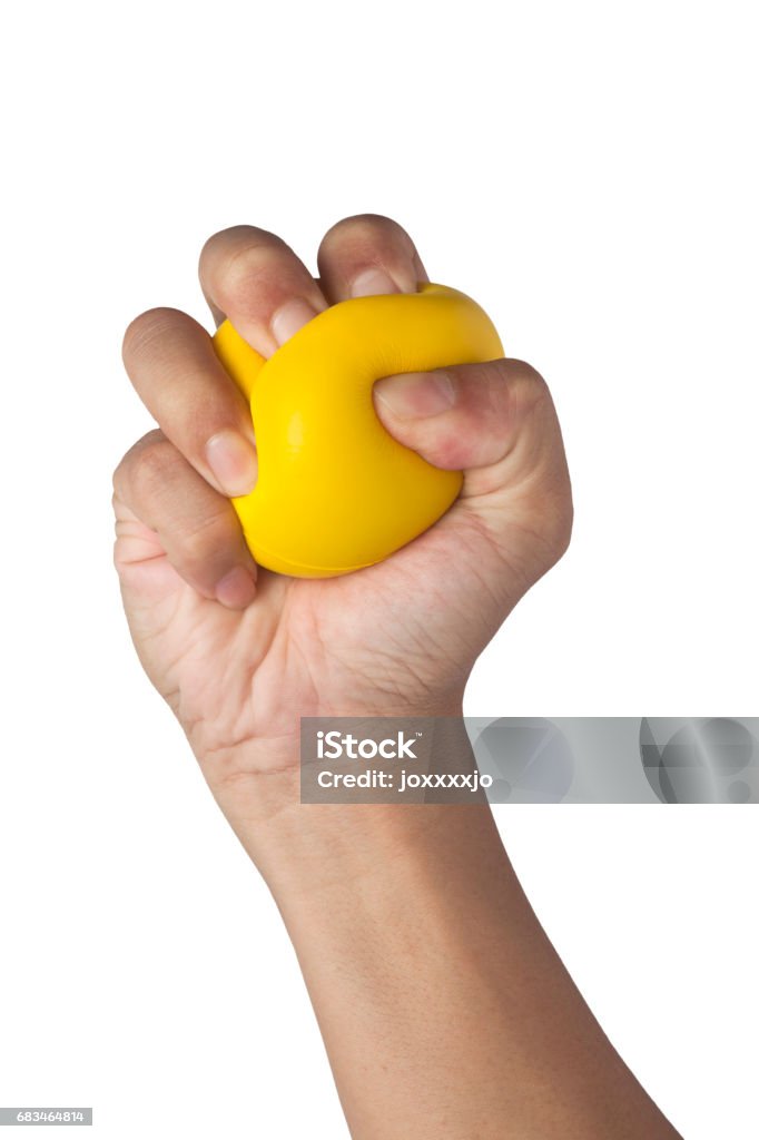 Stress Hand squeezing a stress ball isolated on white background Stress Ball Stock Photo