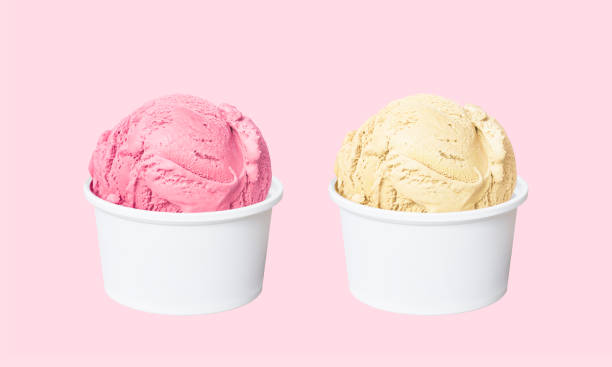 Ice cream scoops in white cups of strawberry and french vanilla flavours isolated on light pink background Ice cream scoops in white cups of strawberry and french vanilla flavours isolated on light pink background (clipping path included) ice-cream-pack stock pictures, royalty-free photos & images