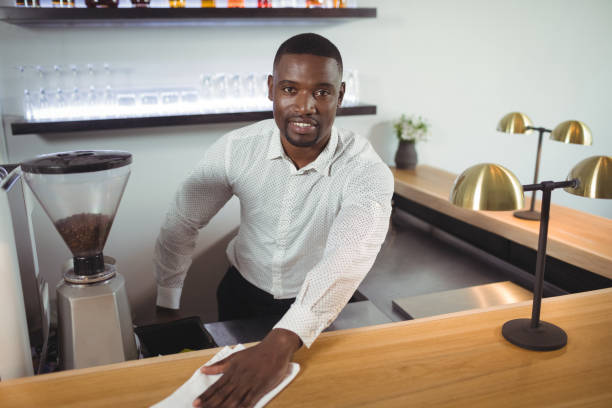 istock Bar tender cleaning bar counter in restaurant 683468608