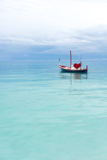 boat with red heart in the ocean
