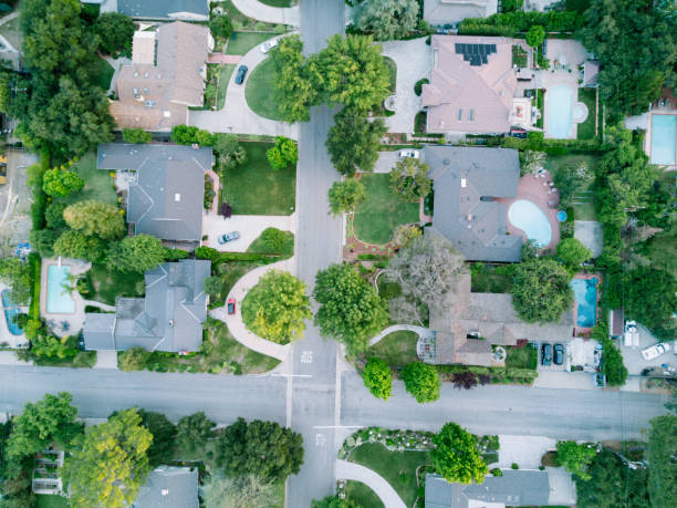 istock Middle-Class Neighborhood with Trees 683472572