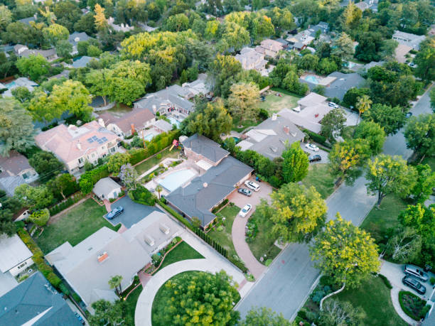 istock Middle-Class Neighborhood with Trees 683472636