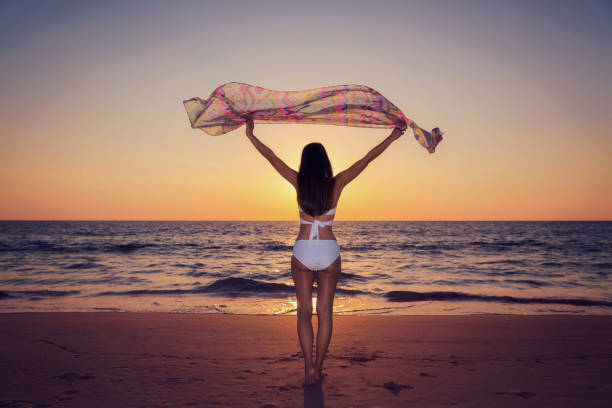 istock Woman relaxing on the beach 683475362