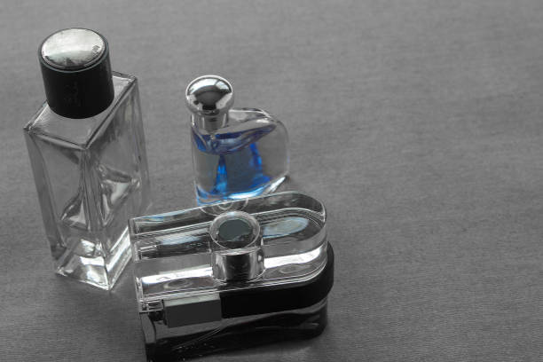 istock Three mens cologne bottles with assorted scents name brand and high quality smells with copyspace. 683475922