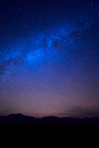 Stars in the dark deep blue starry sky over the Nevada's desert