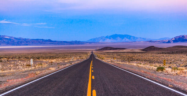 istock The desert highway in Nevada at sunset 683480038