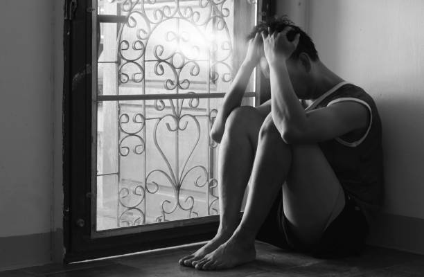 istock Portrait of lonely depressed man sitting 683489896