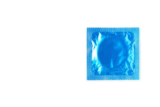 白い背景にコンドームパック - condom contraceptive sensuality healthcare and medicine ストックフォトと画像
