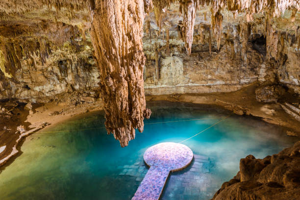 Cenote Suytun at Valladolid, Yucatan - Mexico Cenote Suytun at Valladolid, Yucatan - Mexico - beautiful cenotes with blue, crystal and clear water cenote stock pictures, royalty-free photos & images