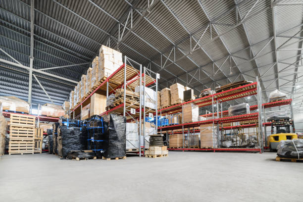 Large hangar warehouse industrial and logistics companies Large hangar warehouse industrial and logistics companies. Warehousing on the floor and called the high shelves. coathanger photos stock pictures, royalty-free photos & images