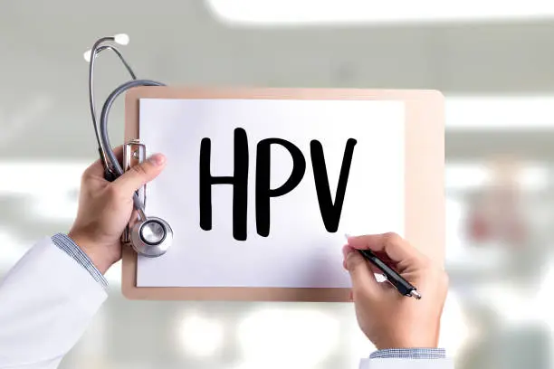 Photo of HPV CONCEPT Virus vaccine with syringe HPV criteria for pap smear slide cytology.