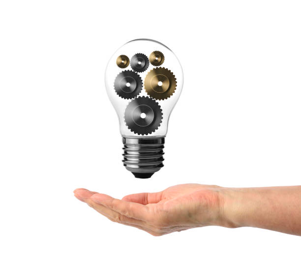 istock Light bulb with gears floating on the hand 683505066