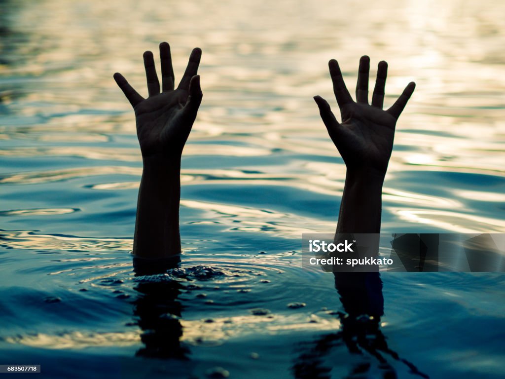 Drowning victims, Hand of drowning man needing help. Failure and rescue concept. Abstract Stock Photo