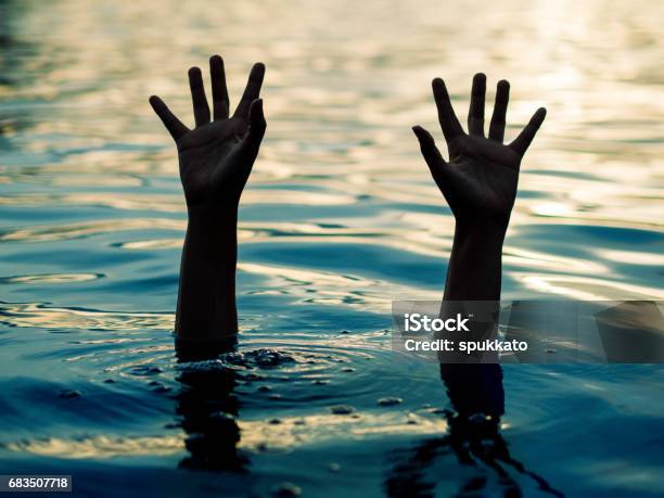 Drowning Victims Hand Of Drowning Man Needing Help Failure And Rescue Concept Stock Photo - Download Image Now