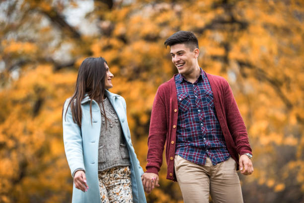 istock Happy couple enjoying in autumn walk and communicating. 683507726