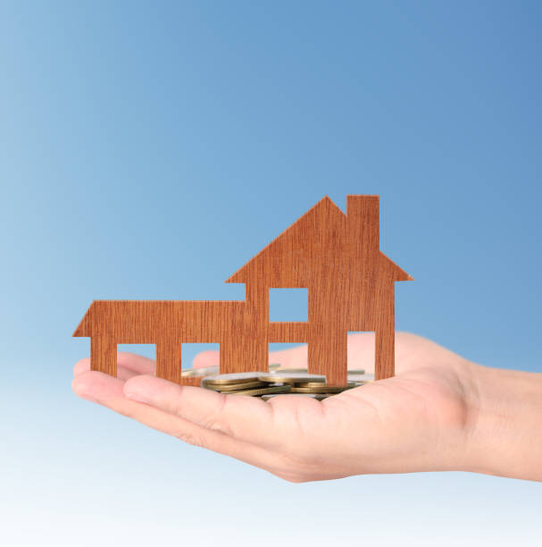 istock Mortgage concept by house from in  hand 683508372