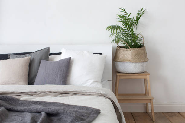 istock Bedroom interior bed and bedside table with plant 683518142
