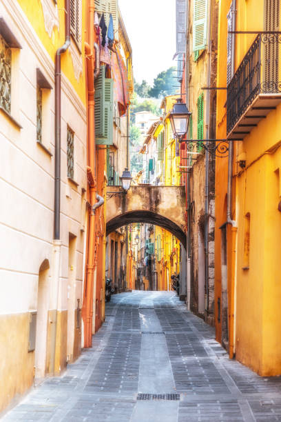 istock Narrow european lane with arch 683518216