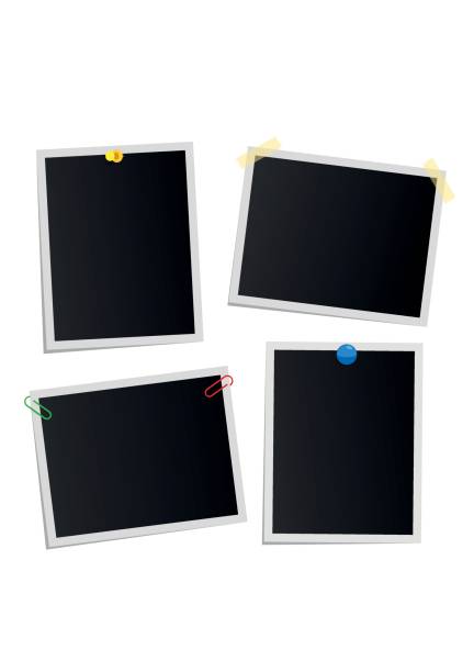 istock Empty attached photos collection on white. Poster of dark pictures with white frames. Cards or reminders templates attached with pushpins, paperclips and scotch tape collection 683518590