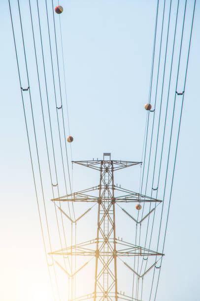istock electricity, View of sunrise behind the cable 683519406