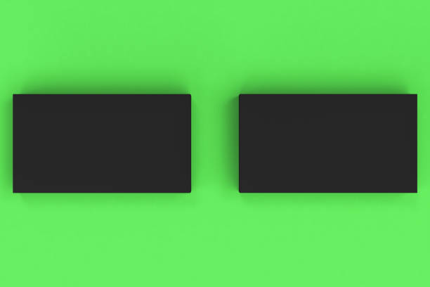 istock Black blank business cards mock-up on green background 683523568