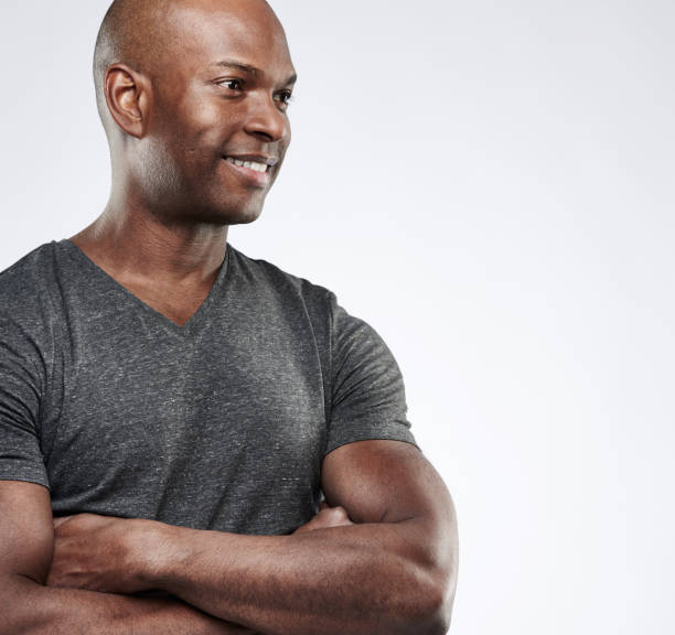 istock Man with folded muscular arms looking toward space 683526678