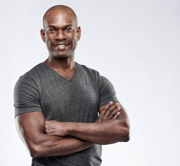 istock Attractive muscular happy man with folded arms 683526988