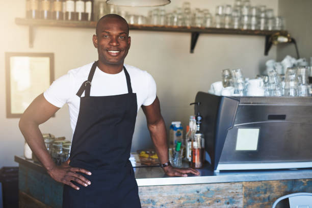 istock Confident male coffee house owner at counter 683527184