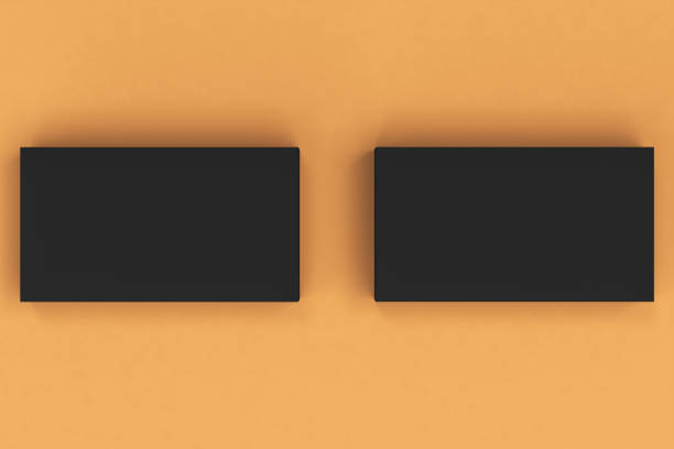 istock Black blank business cards mock-up on orange background 683527464