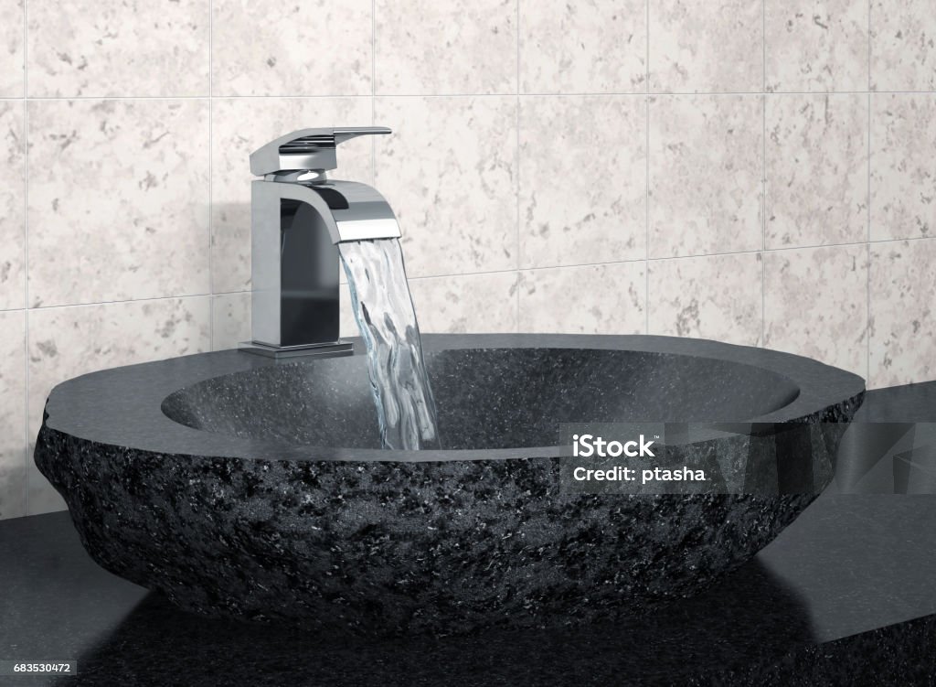 Bathroom faucet and black stone sink Bathroom faucet with flowing water and black stone sink. 3D rendering Bathroom Stock Photo