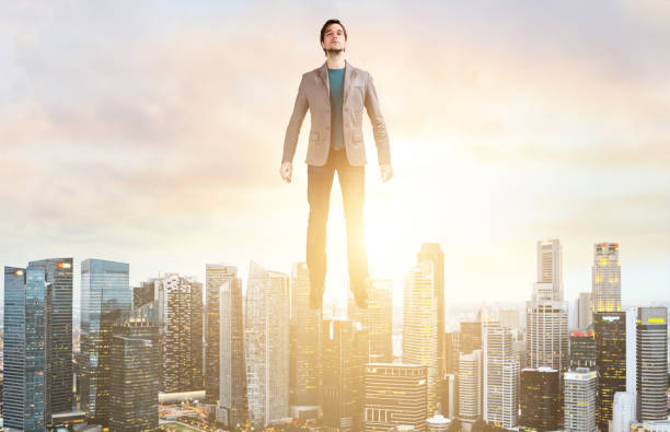 istock Business man hover over city skyline 683530786