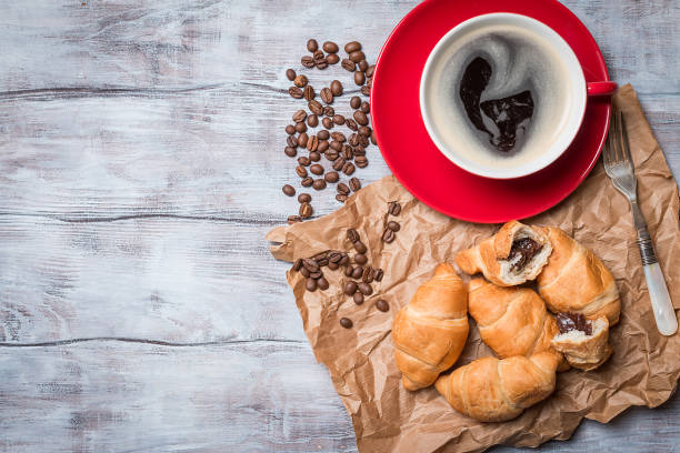 istock Fresh croissants and coffee 683533654