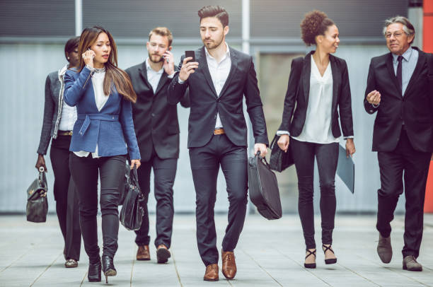 istock Business people walking Along The Street 683533904