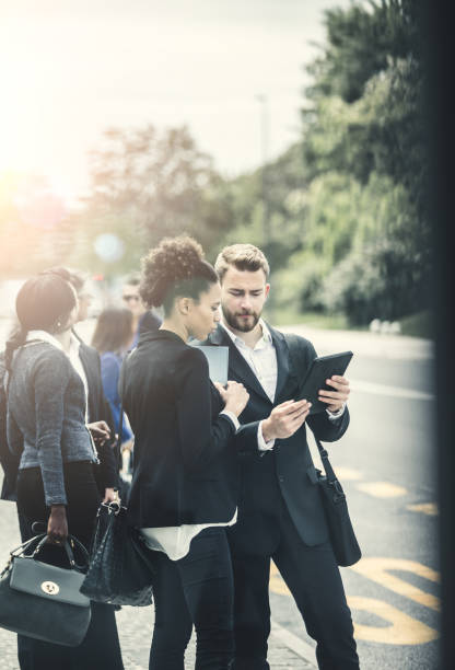 istock Business People Standing in Street and Discussing 683534264