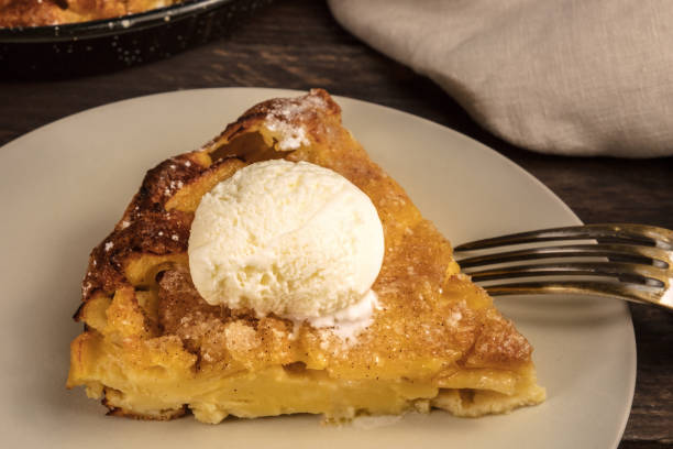 istock Slice of apple pie with icecream cone on blurred background 683534642