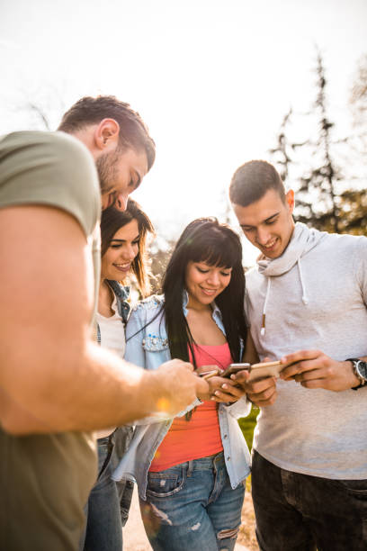 istock group of friends doing social networking 683534658