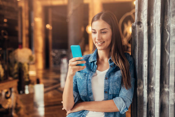 istock Beautiful woman texting 683535386
