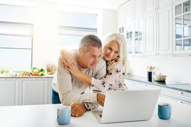 istock Couple of old people using a laptop 683539358