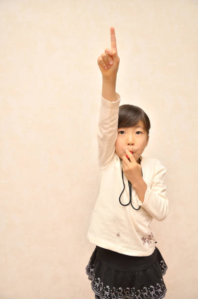a girl who is making a hot ball