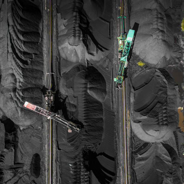 istock Black coal deposits. Exploration and machine. View from above. 683540248