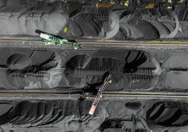 istock Black coal deposits. Exploration and machine. View from above. 683540258