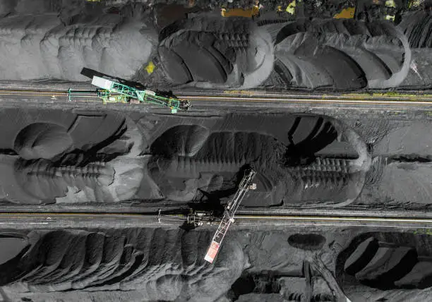 Black coal deposits. Exploration and machine. View from above.